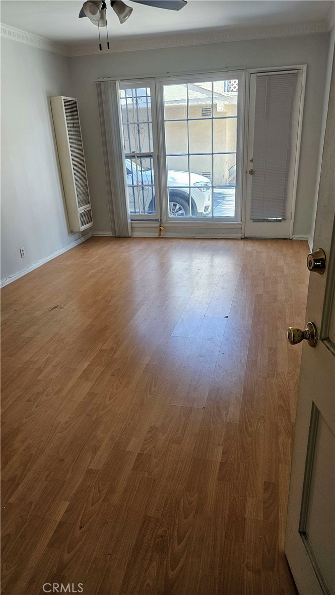 209 South Reeves Drive Beverly Hills, CA 90212 - Photo 2 of 8 a view of an empty room with a window