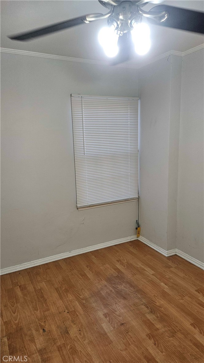 209 South Reeves Drive Beverly Hills, CA 90212 - Photo 5 of 8 a view of an empty room with a window