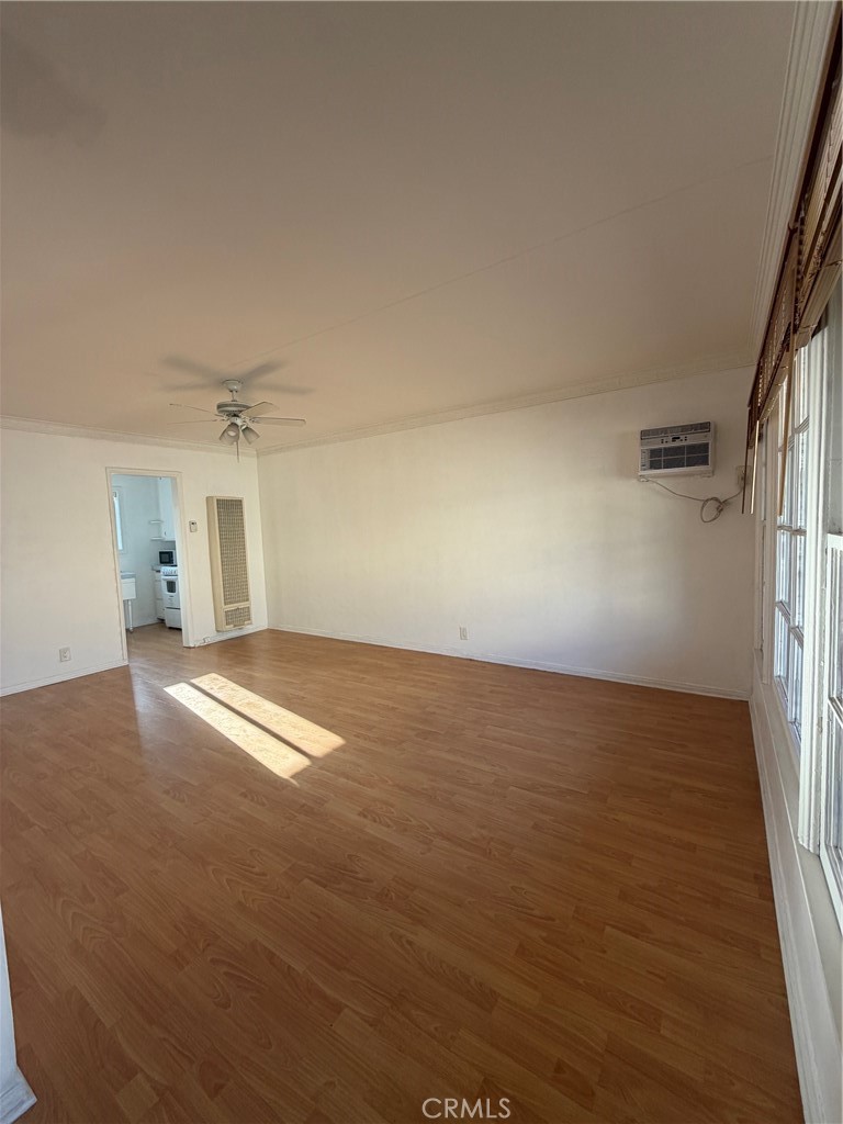 209 South Reeves Drive Beverly Hills, CA 90212 - Photo 6 of 14 a view of empty room with wooden floor
