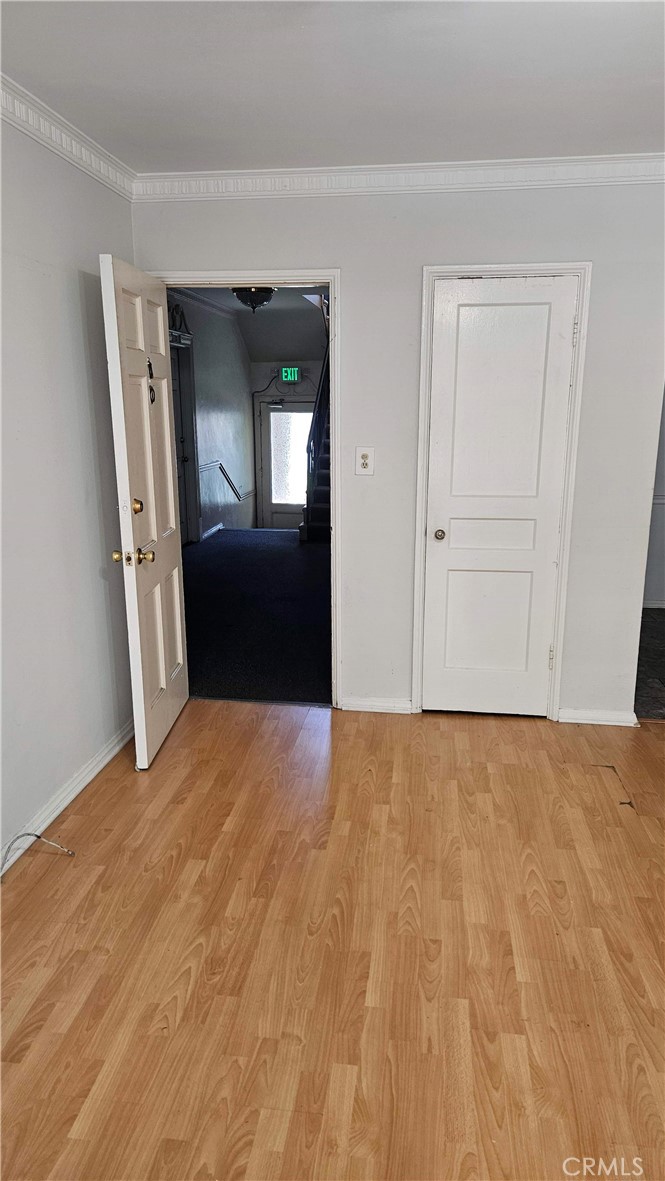 209 South Reeves Drive Beverly Hills, CA 90212 - Photo 7 of 8 a view of empty room with wooden floor and fan