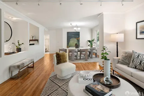 a living room with furniture or couch and a lamp