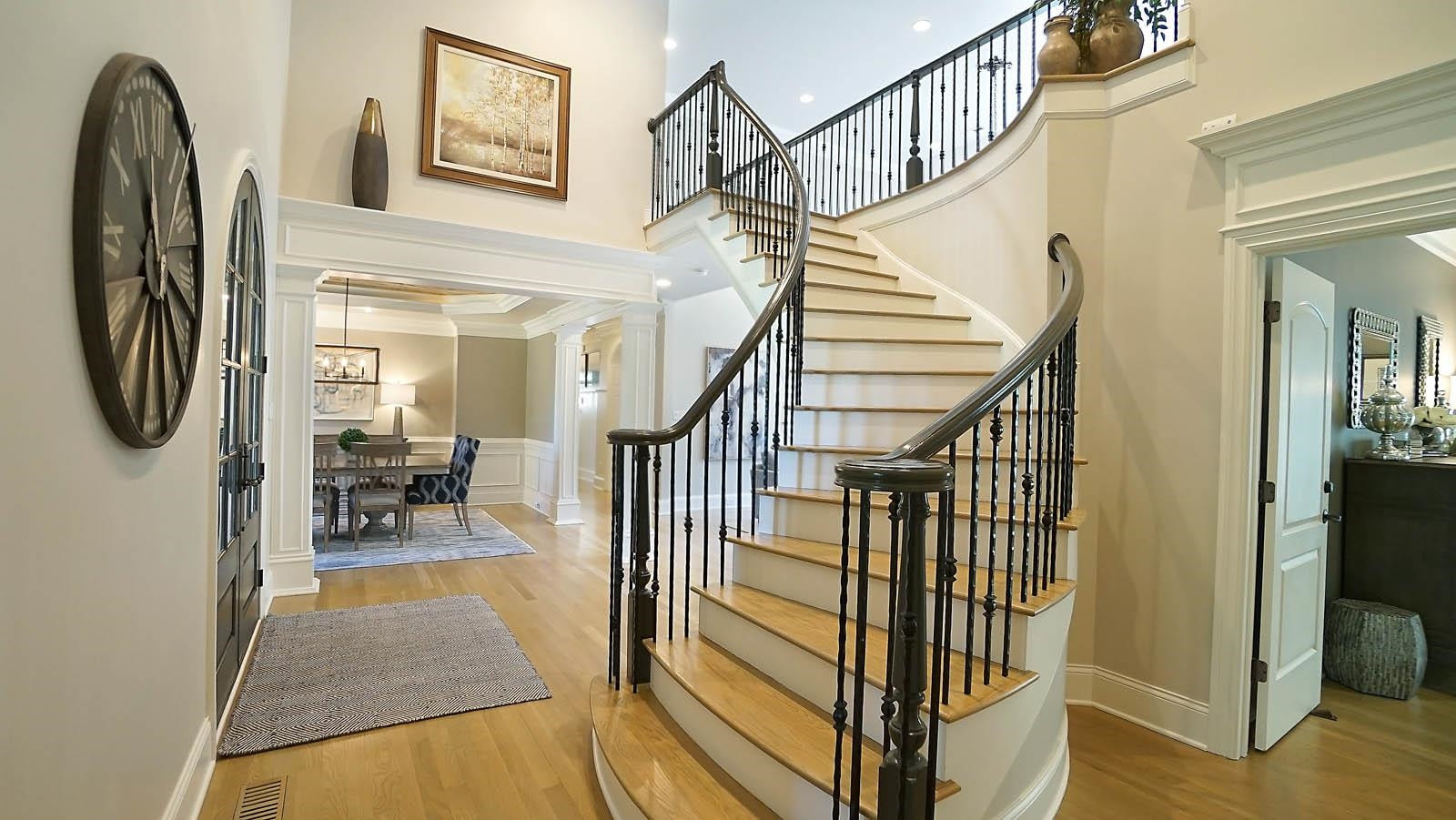 1129 Devlin Court Raleigh, NC 27614 - Photo 14 of 63 Gorgeous curved staircase with iron balusters and catwalk overlooking family room Foyer