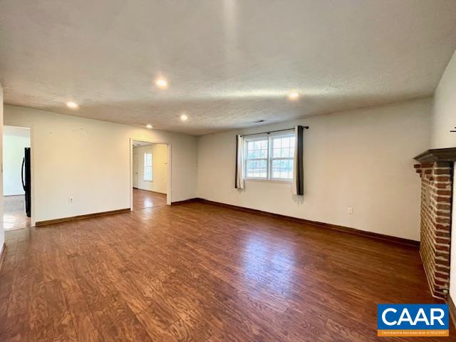 285 Price Road Louisa, VA 23093 - Photo 9 of 22 an empty room with wooden floor and windows