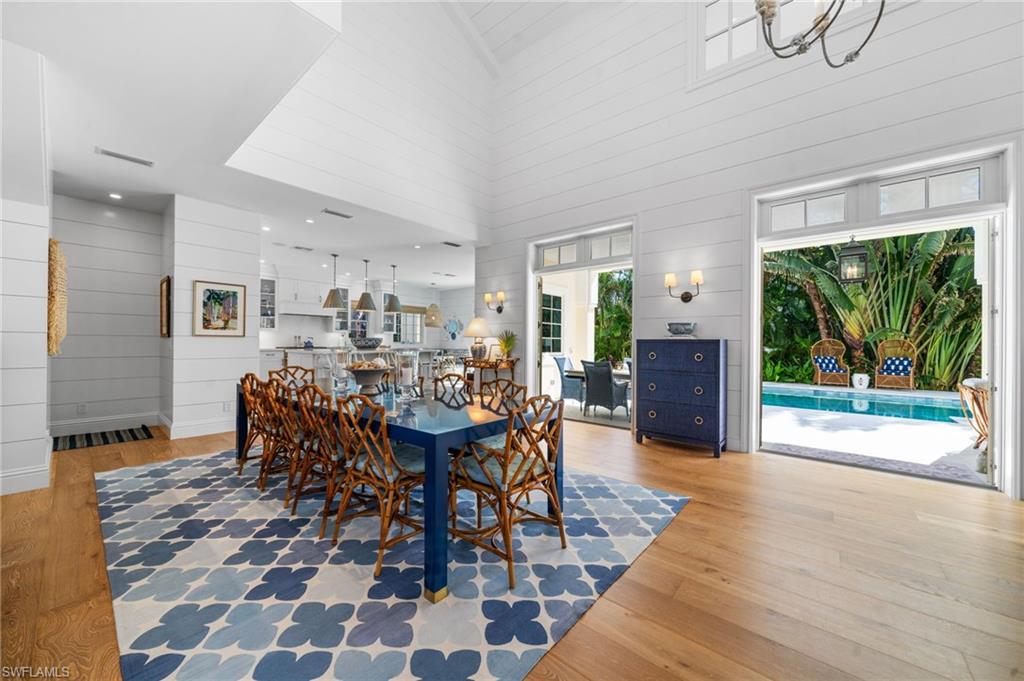 390 Windward Way Naples, FL 34103 - Photo 14 of 42 a view of a dining room with furniture window and outside view