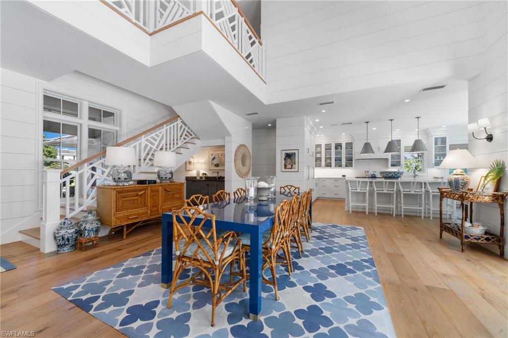 390 Windward Way Naples, FL 34103 - Photo 15 of 42 a view of a dining room with furniture