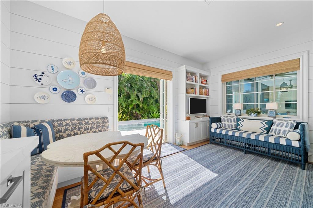 390 Windward Way Naples, FL 34103 - Photo 19 of 42 a living room with furniture and a flat screen tv