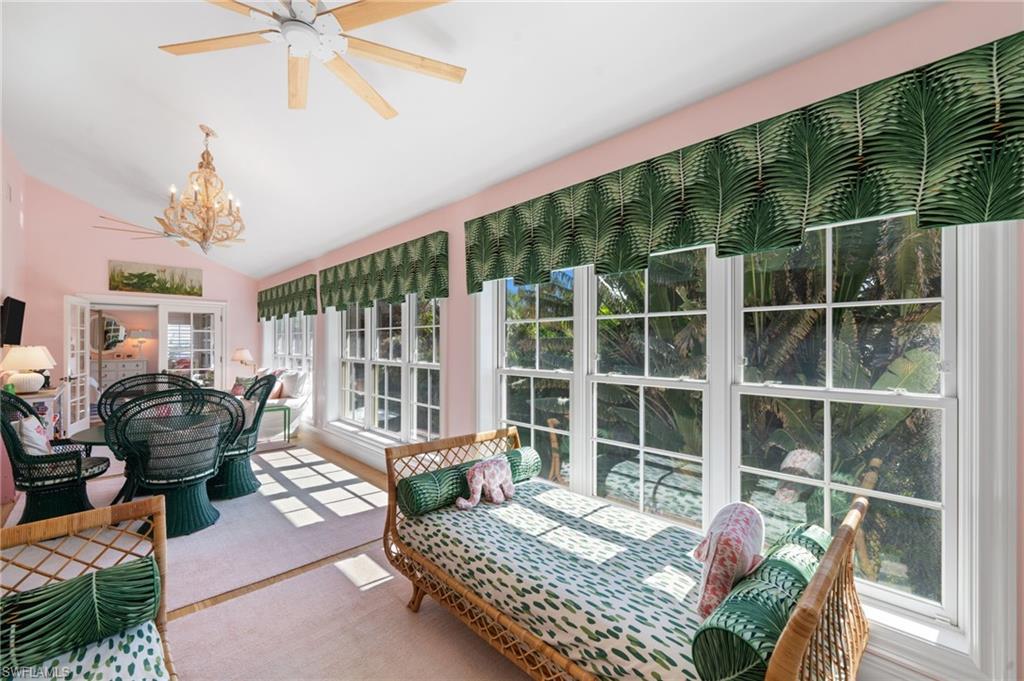 390 Windward Way Naples, FL 34103 - Photo 31 of 42 a bedroom with furniture and a large window