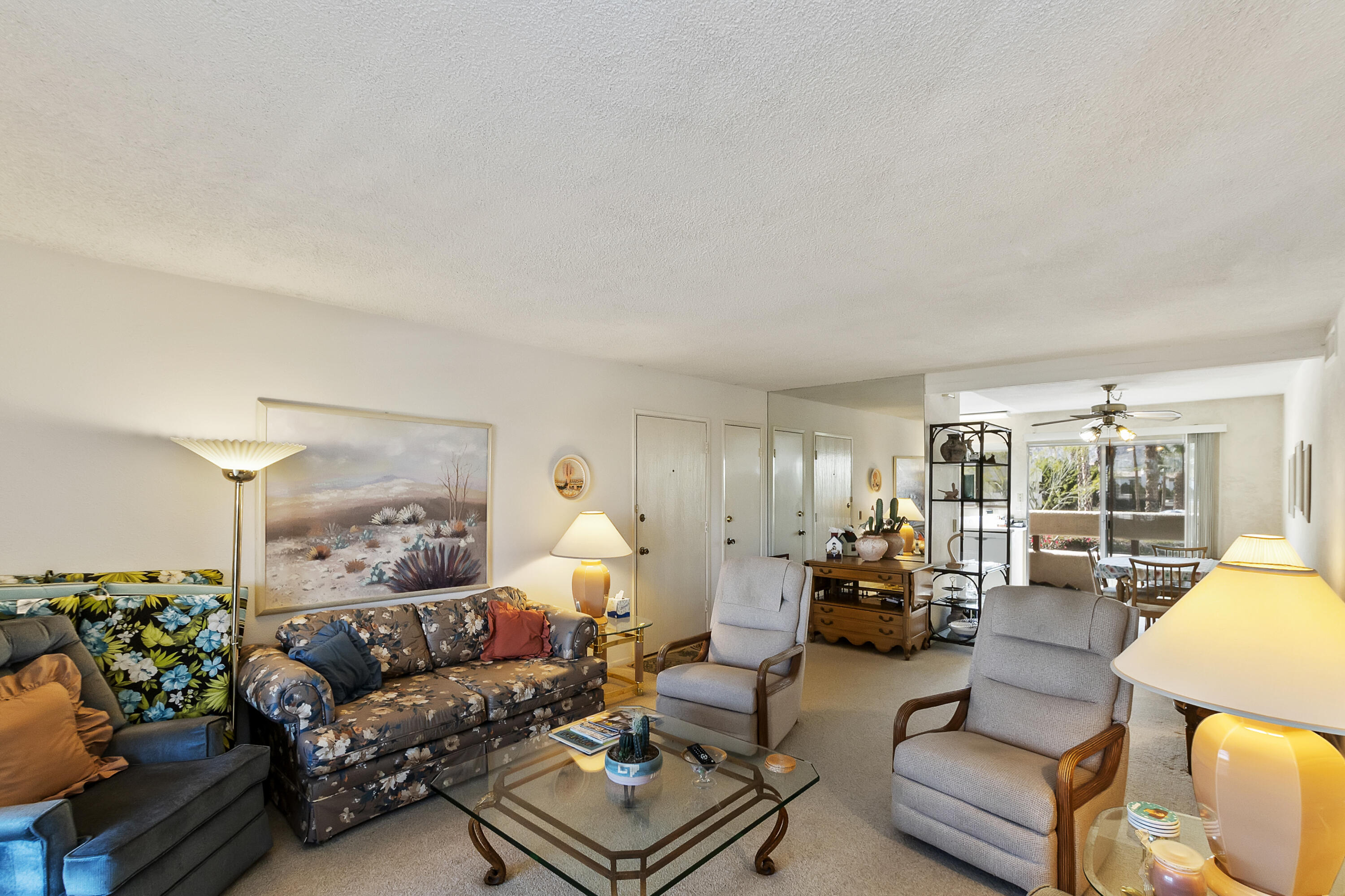 1268 Ramon Road, Unit 30 Palm Springs, CA 92264 - Photo 8 of 28 a living room with furniture and a large window