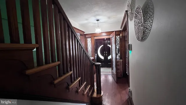 a view of entryway with wooden floor