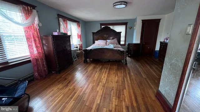 a bedroom with a bed and a mirror