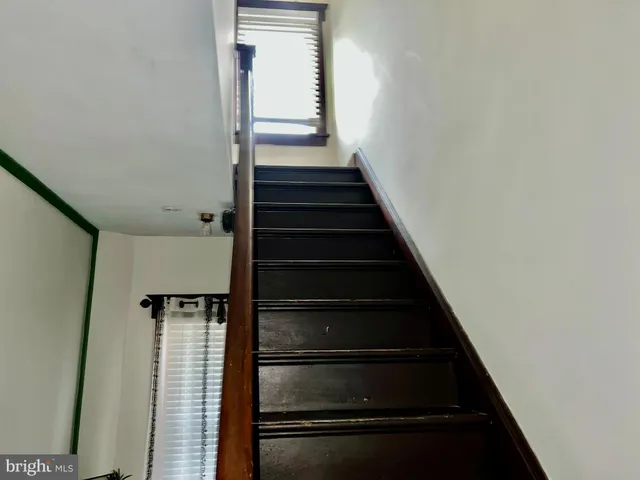 an empty room with wooden floor