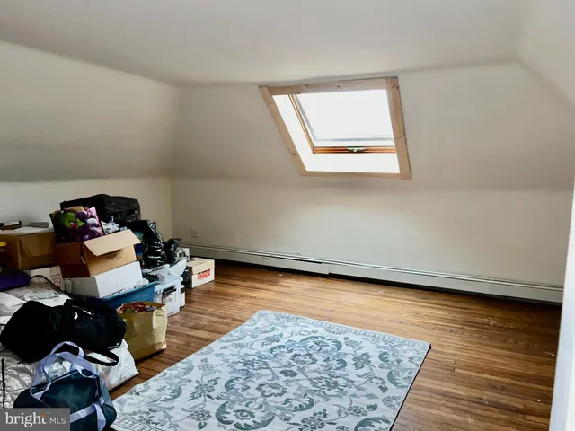 a view of a livingroom with furniture and floor to ceiling window
