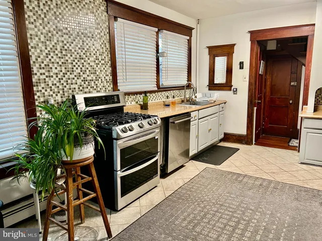 a kitchen with a stove and a sink