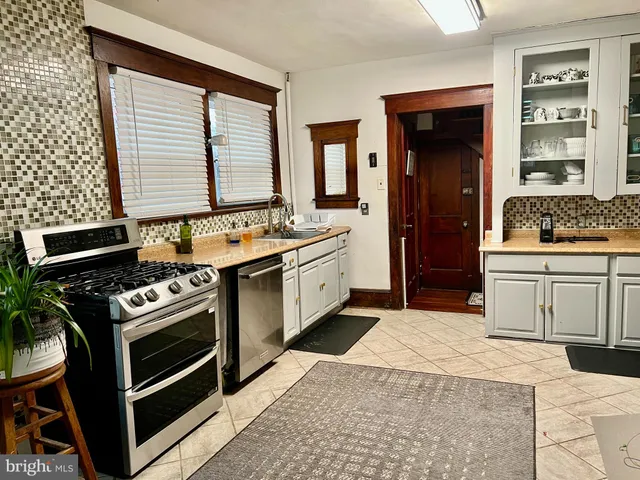 a kitchen with a stove and a sink