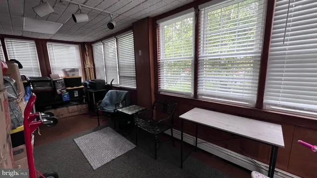 a reading room with furniture and a window