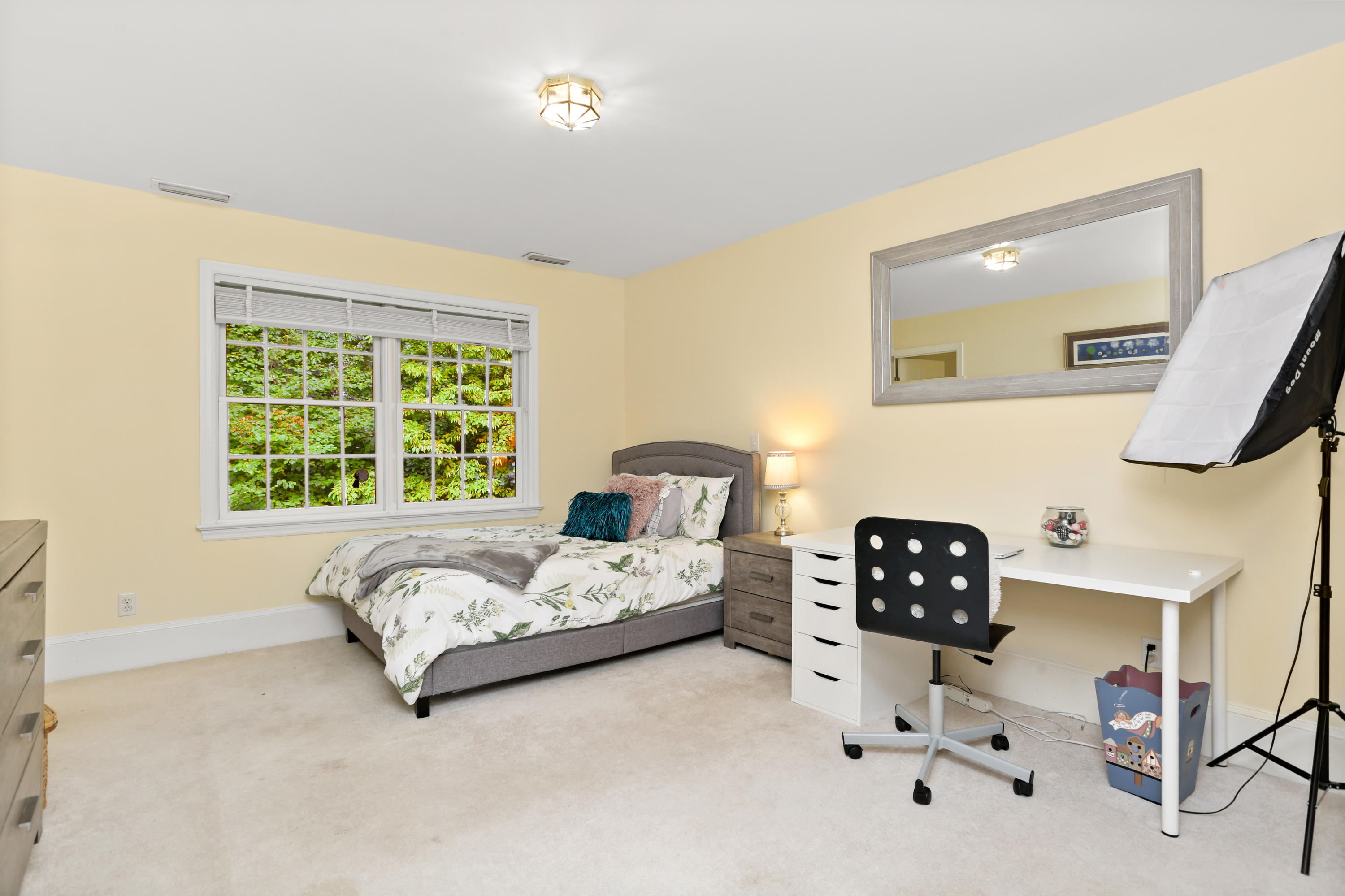 5 Stony Brook Road South Darien, CT 06820 - Photo 20 of 27 a bedroom with a bed and a large window
