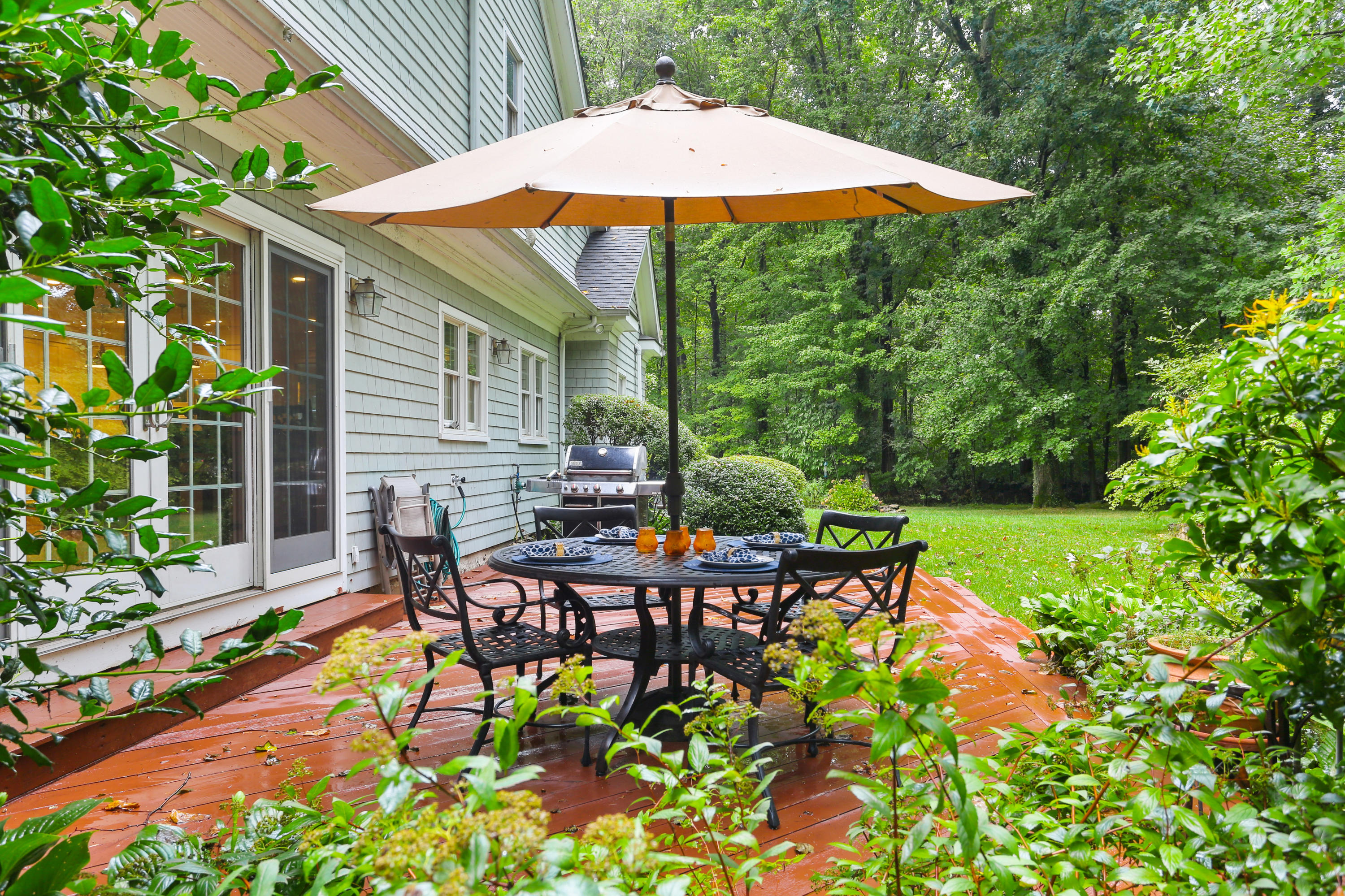 5 Stony Brook Road South Darien, CT 06820 - Photo 4 of 27 an outdoor space with furniture and umbrella