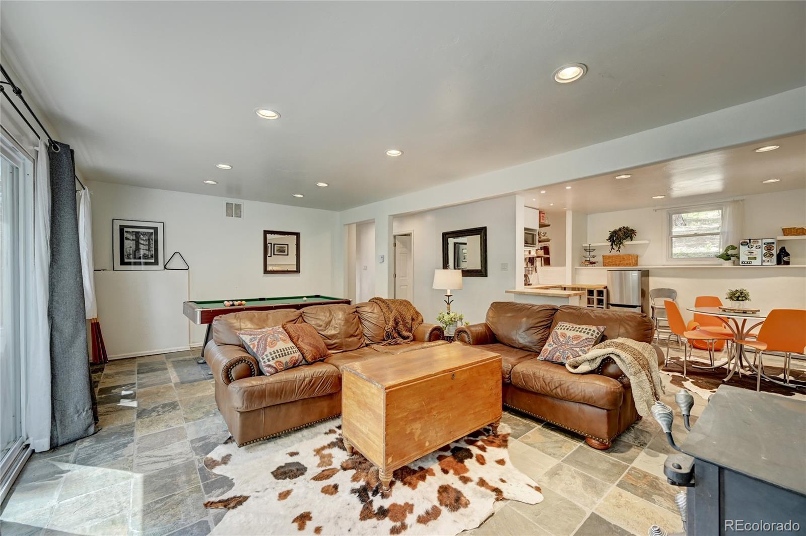 6549 Modoc Lane Evergreen, CO 80439 - Photo 24 of 39 a living room with furniture and a couch