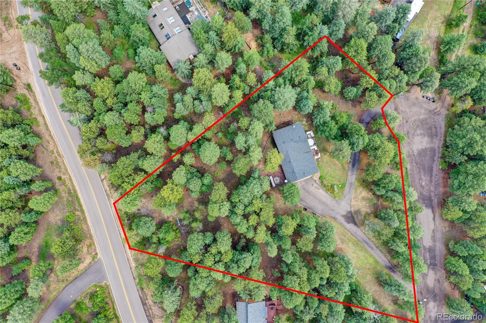 6549 Modoc Lane Evergreen, CO 80439 - Photo 36 of 39 an aerial view of residential houses with outdoor space and trees