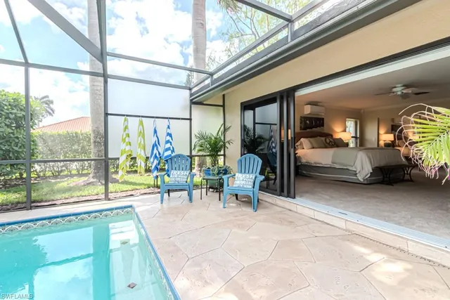 a living room with a large window and couch