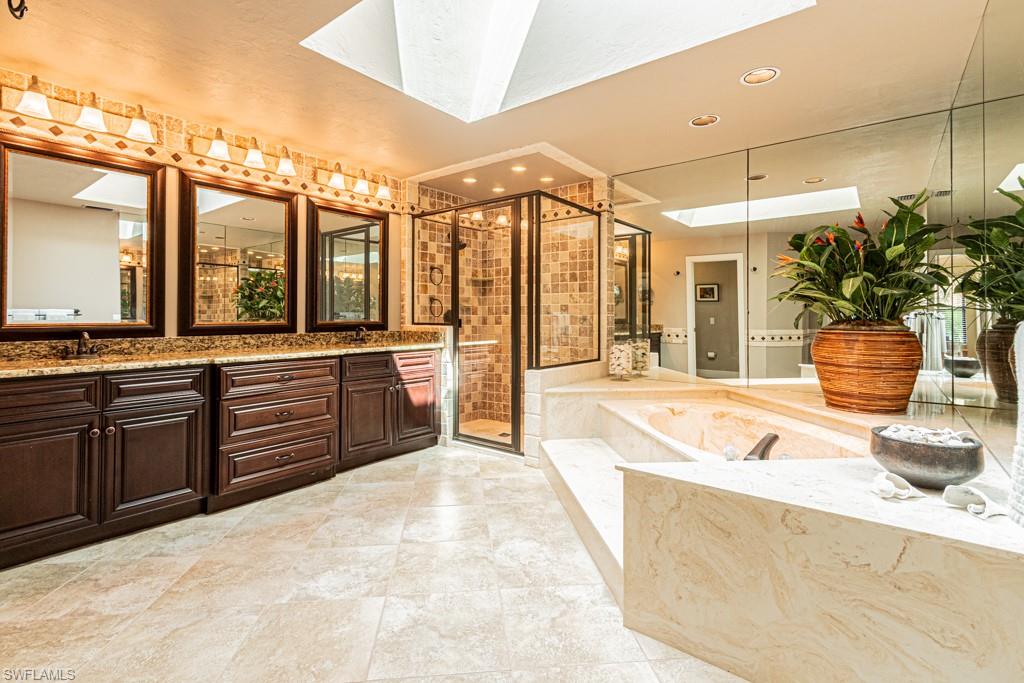 2308 Kings Lake Boulevard Naples, FL 34112 - Photo 22 of 36 a large white kitchen with a large window