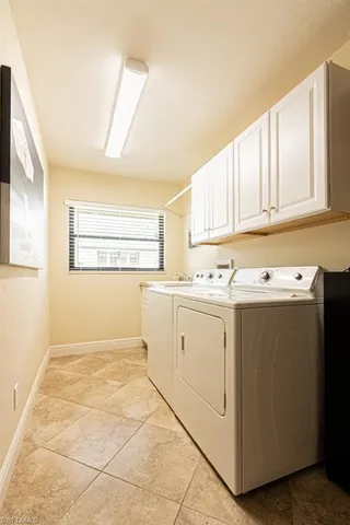 a view of kitchen with white cabinets