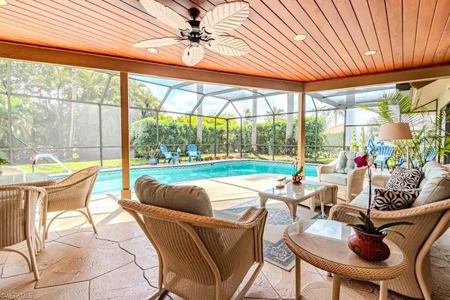 a bathroom with a toilet and a mirror
