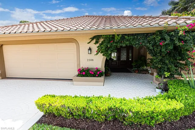 a front view of a house with a garage
