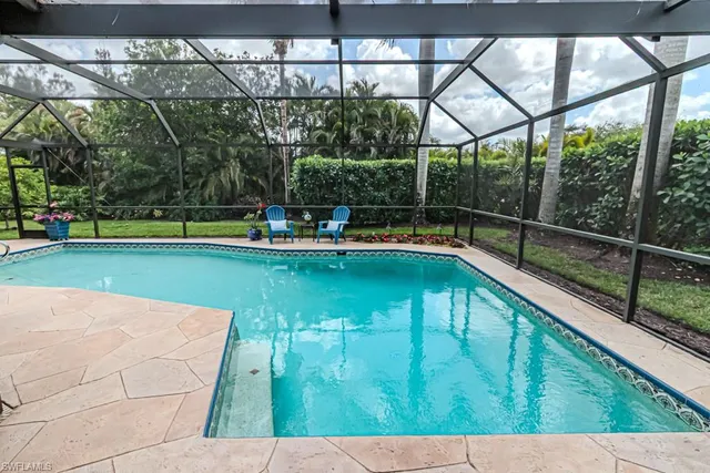 a view of swimming pool with a patio