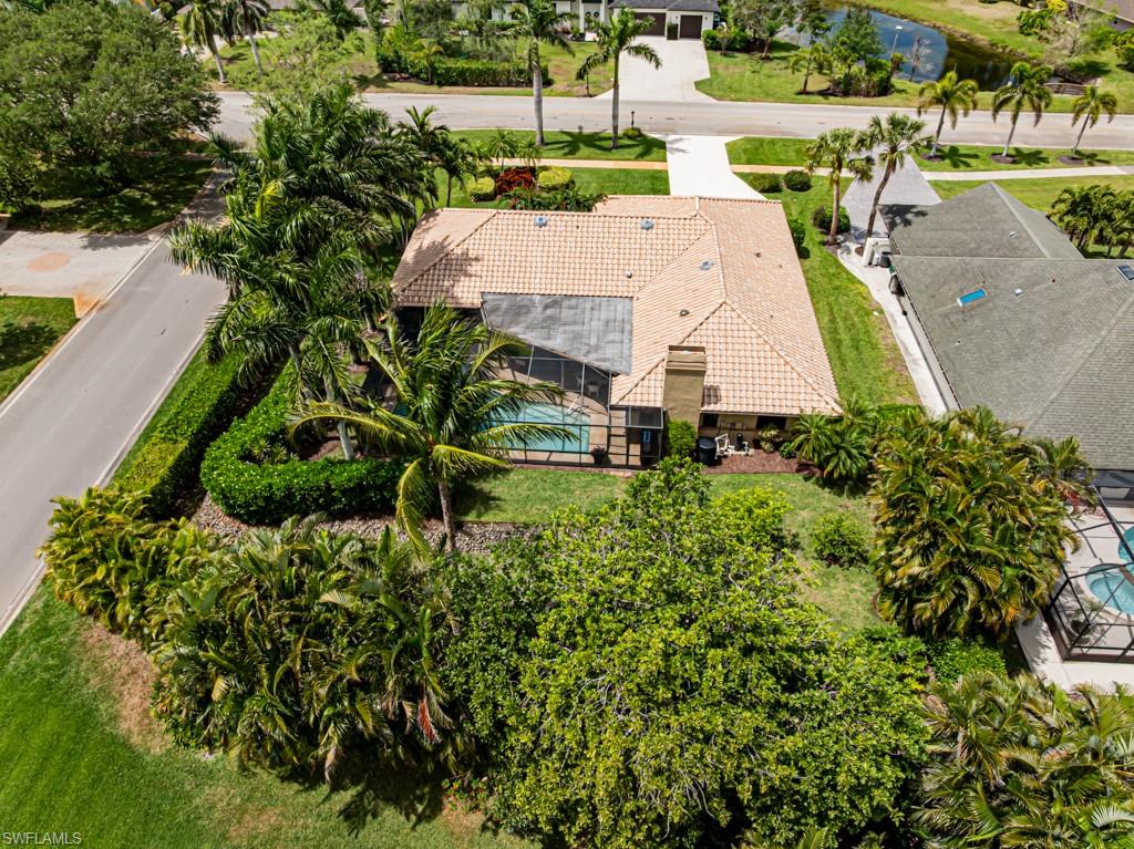 2308 Kings Lake Boulevard Naples, FL 34112 - Photo 35 of 36 an aerial view of a house with a yard and lake view