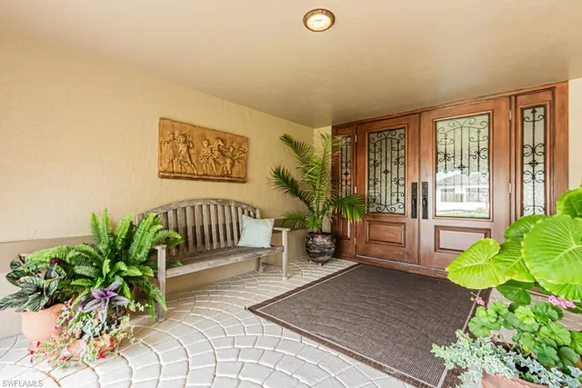 a view of front door with potted plant