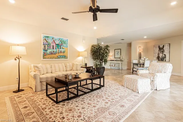 a living room with furniture and a rug