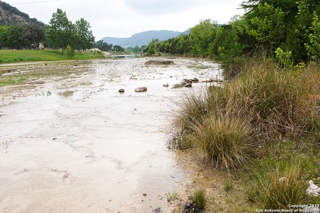 a view of lake view with mountain and trees around