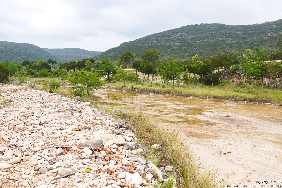 35298 Ranch To Market Road 187 Vanderpool, TX 78885 - Photo 12 of 29 a view of a backyard of a house