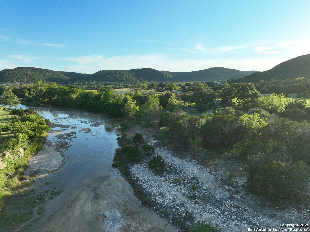 35298 Ranch To Market Road 187 Vanderpool, TX 78885 - Photo 2 of 29 a view of lake with mountain