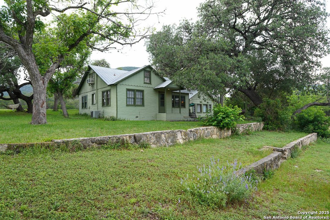 35298 Ranch To Market Road 187 Vanderpool, TX 78885 - Photo 7 of 29 a view of house with a big yard