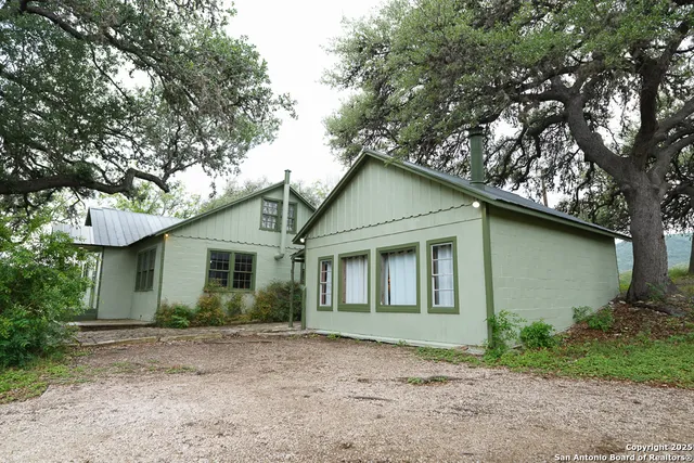 a house with trees in the background