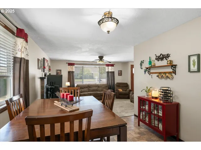 a view of a dining room with furniture and a kitchen