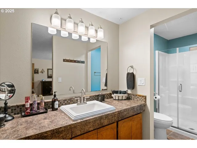 a bathroom with a sink double vanity and a mirror