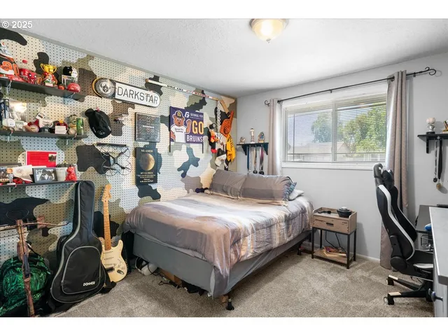 a bedroom with a bed and a tv