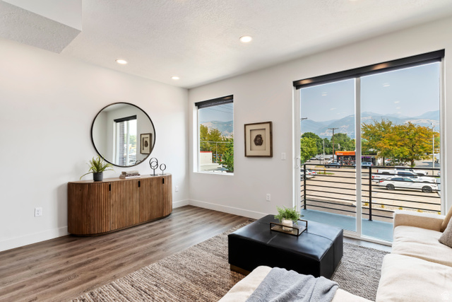 32 West 400 South Bountiful, UT 84010 - Photo 6 of 31 Living area featuring wood finished floors, a mountain view, recessed lighting, and a textured ceiling. Model Home