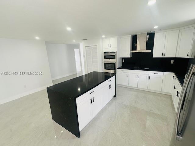 11870 Southwest 5th Street, Unit 1 Miami, FL 33184 - Photo 7 of 38 a kitchen with granite countertop a white stove top oven and white cabinets