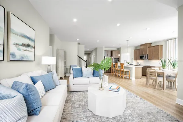 a living room with furniture and a large window