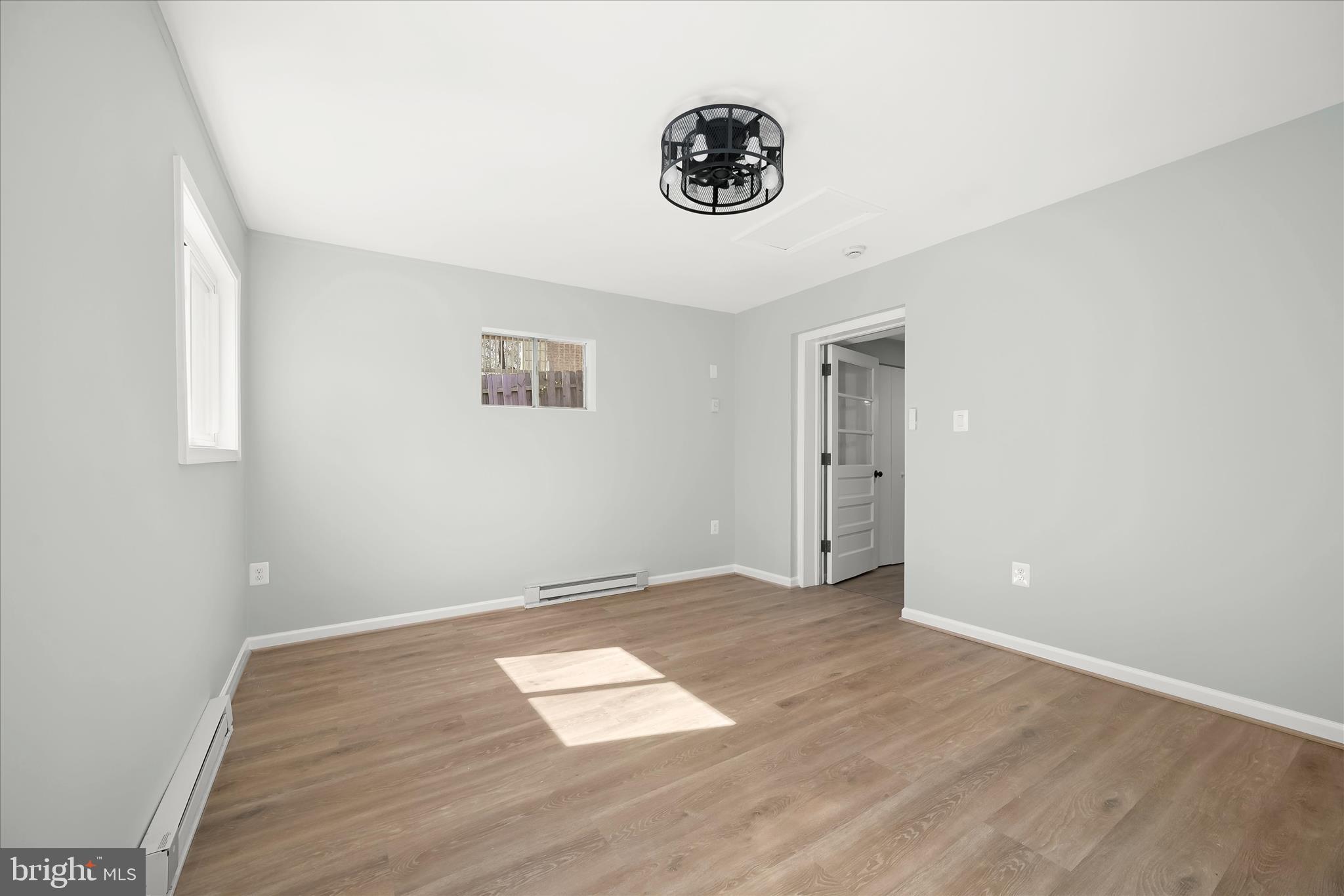 9720 Hedin Drive Silver Spring, MD 20903 - Photo 61 of 79 an empty room with a wooden floor and a window