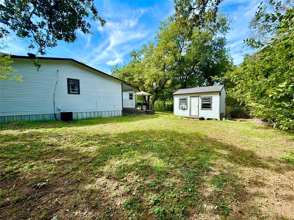 532 Marquette Avenue Azle, TX 76020 - Photo 11 of 32 a view of a house with a yard
