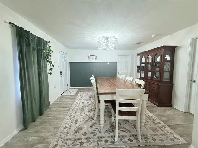 a view of a dining room with furniture