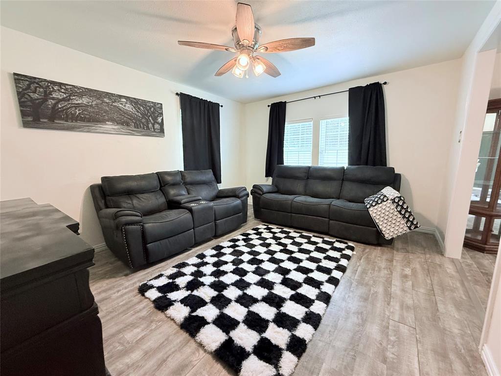 532 Marquette Avenue Azle, TX 76020 - Photo 18 of 32 a living room with furniture and wooden floor