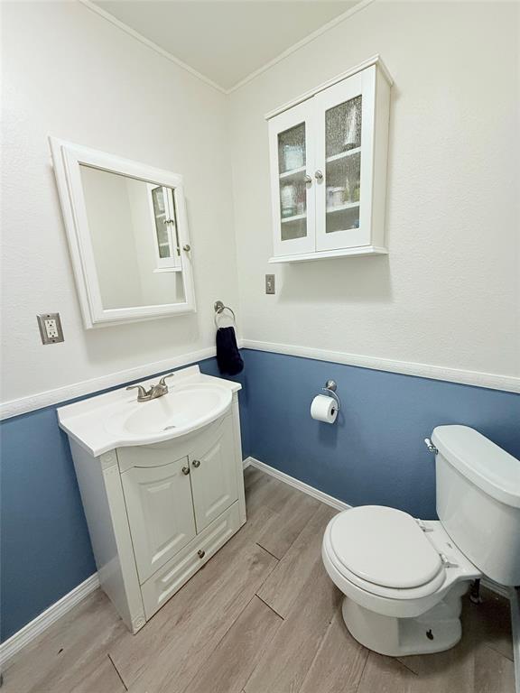 532 Marquette Avenue Azle, TX 76020 - Photo 24 of 32 a bathroom with a sink a toilet and mirror
