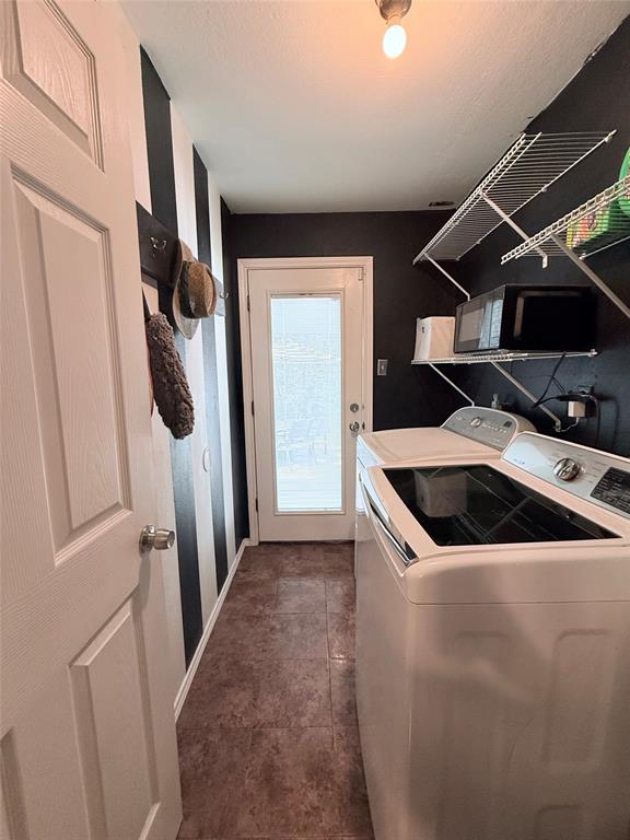 532 Marquette Avenue Azle, TX 76020 - Photo 31 of 32 a kitchen with a stove and a refrigerator
