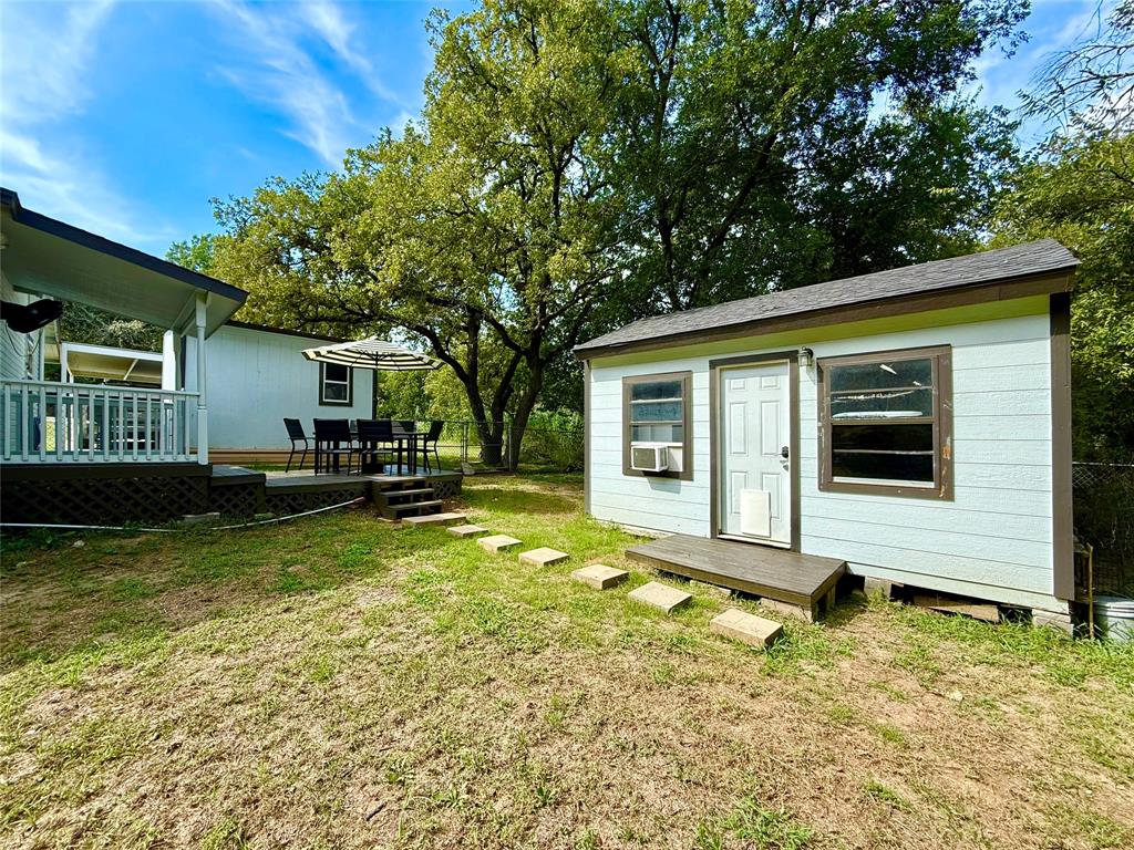 532 Marquette Avenue Azle, TX 76020 - Photo 5 of 32 a view of house with backyard and swimming pool